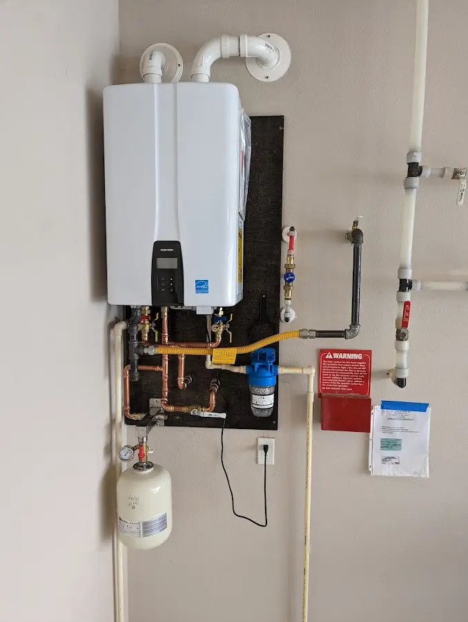 Professional plumber installing copper piping in a Schuylkill home